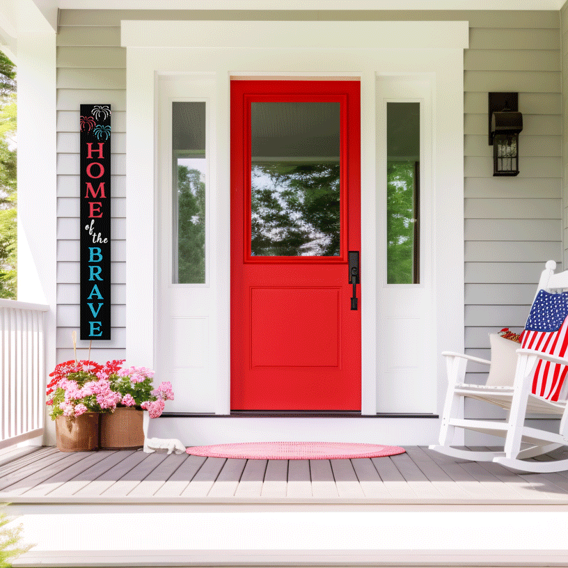 Patriotic chalkboard welcome sign next to red front door on porch with 4th of July decorations