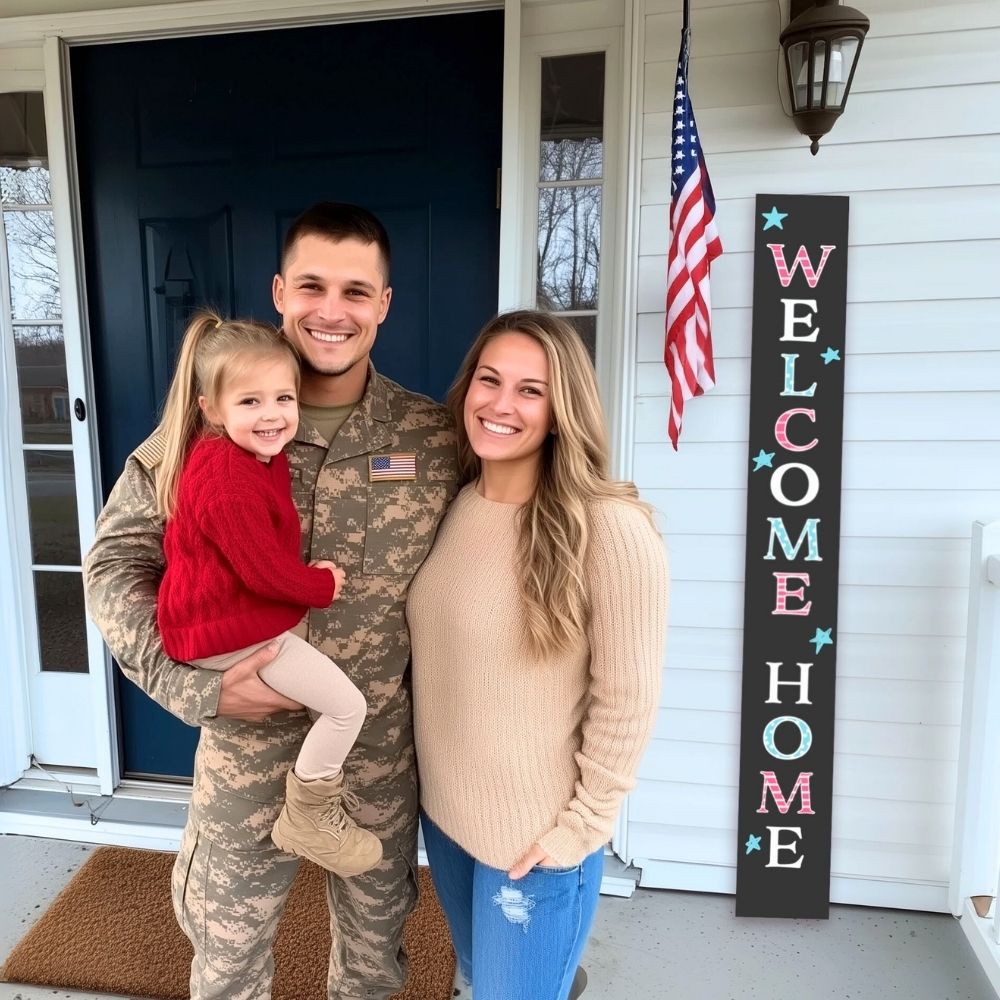 Military family posing on their front porch with a &#39;Welcome Home&#39; porch sign created using large outdoor chalkboard, magnetic letter stencils, erasable paint markers from Plata Chalkboards DIY Welcome Sign Kit